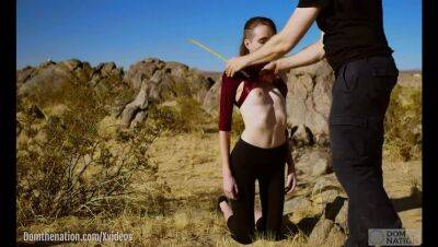 Petite, hardcore submissive masochist Brooke Johnson drinks piss, gets a hard caning, and get a severe facesitting rimjob session on the desert rocks of Joshua Tree in this Domthenation documentary - xxxfiles.com